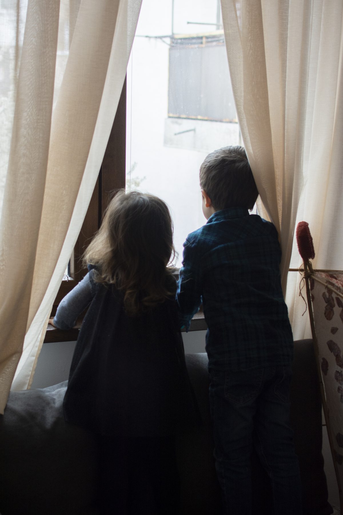 kids looking outside the window