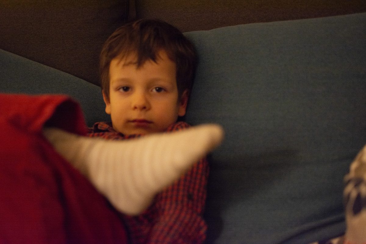 a blurry picture of my bored and angry son